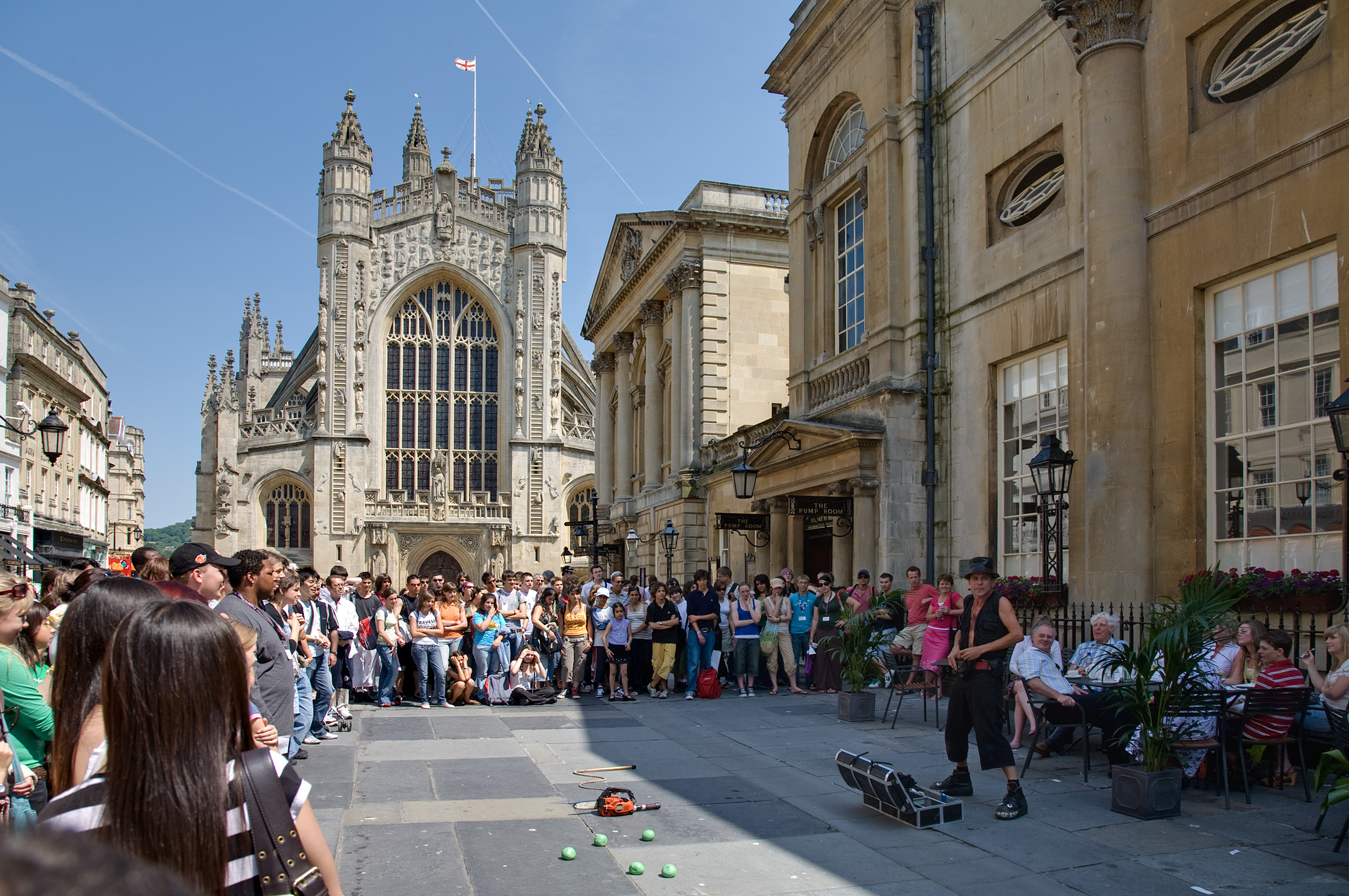Street performer beside Bath Abbey and the Pump Room